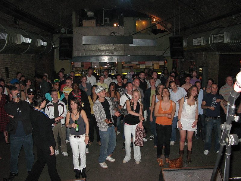 A packed, low-ceilinged club crowd