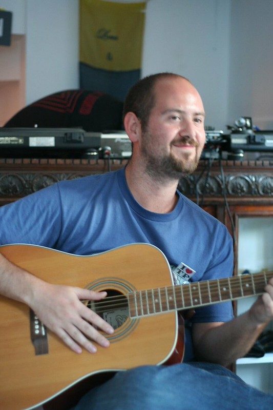 Guitarist smiling mid-session